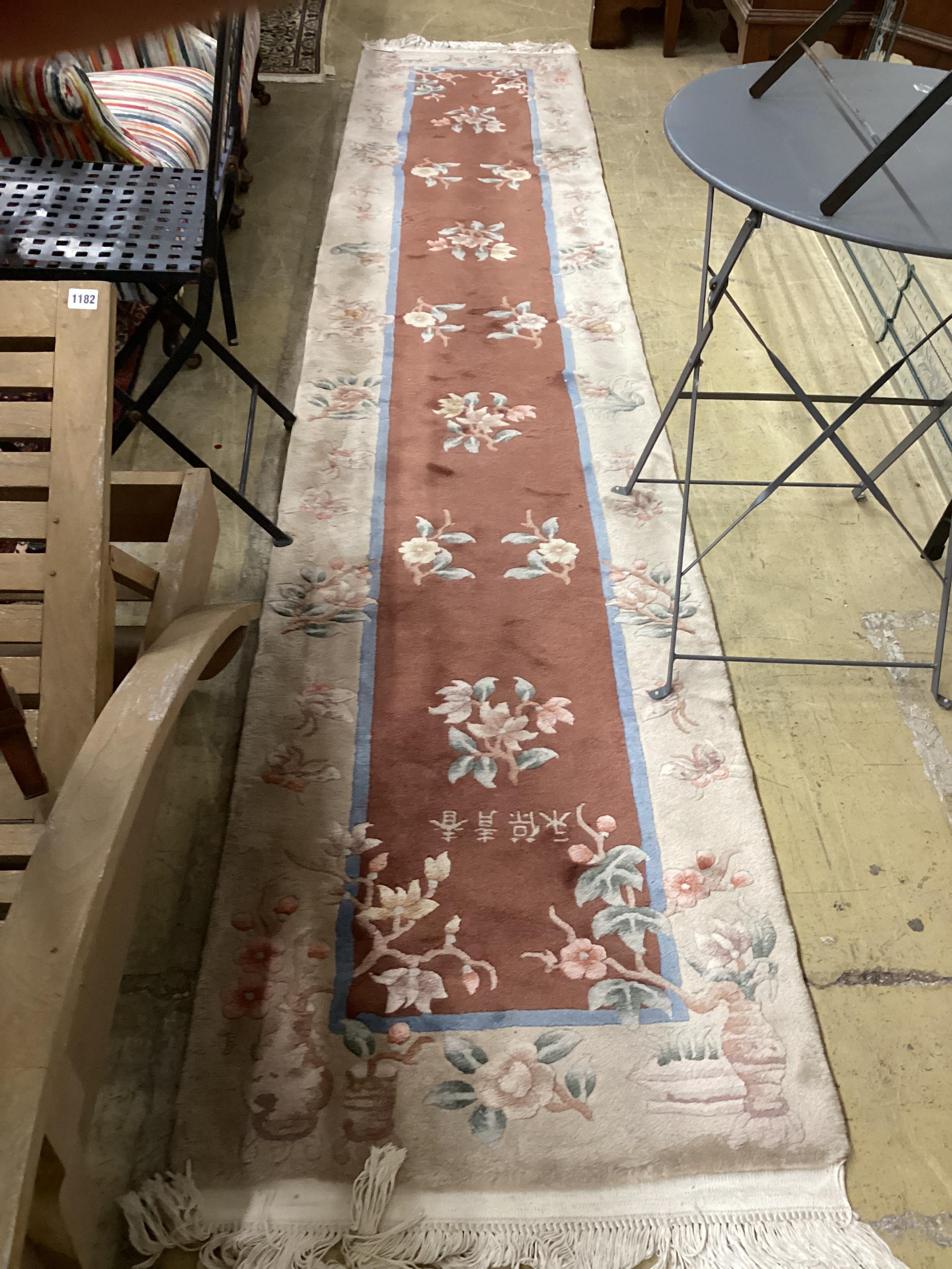 Two Chinese fawn ground floral runners, both 360cm x 70cm.